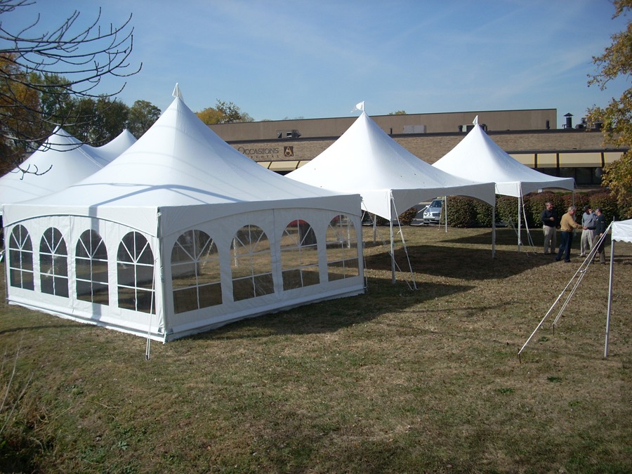 About Us 20x20 high peak tent with sidewalls set up by the Tents and Things crew